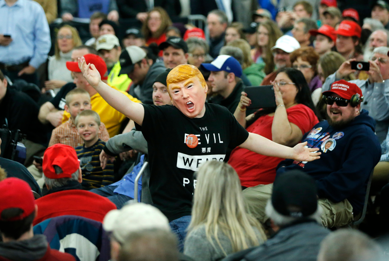 A Trump supporter wears a mask at a Trump rally on April 2, 2016, in Rothschild, Wisconsin (AP Photo/Charles Rex Arbogast)